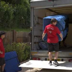 Removal team member from Hitchin Removals securing furniture in a moving truck